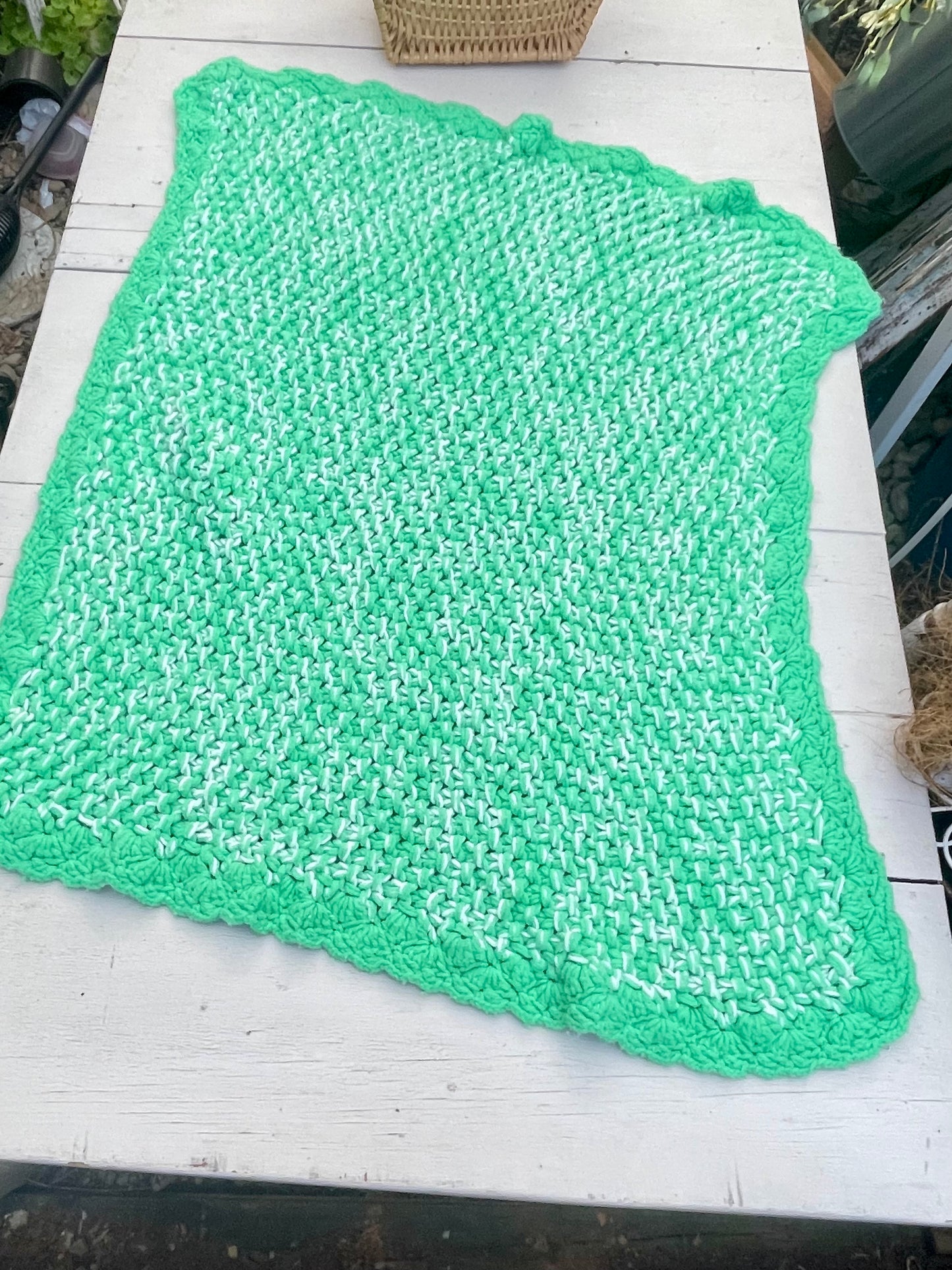 Green crocheted, baby blanket