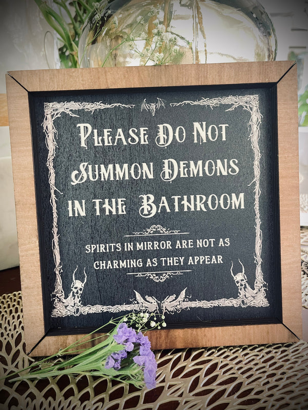 Please do not summon demons in the bathroom sign