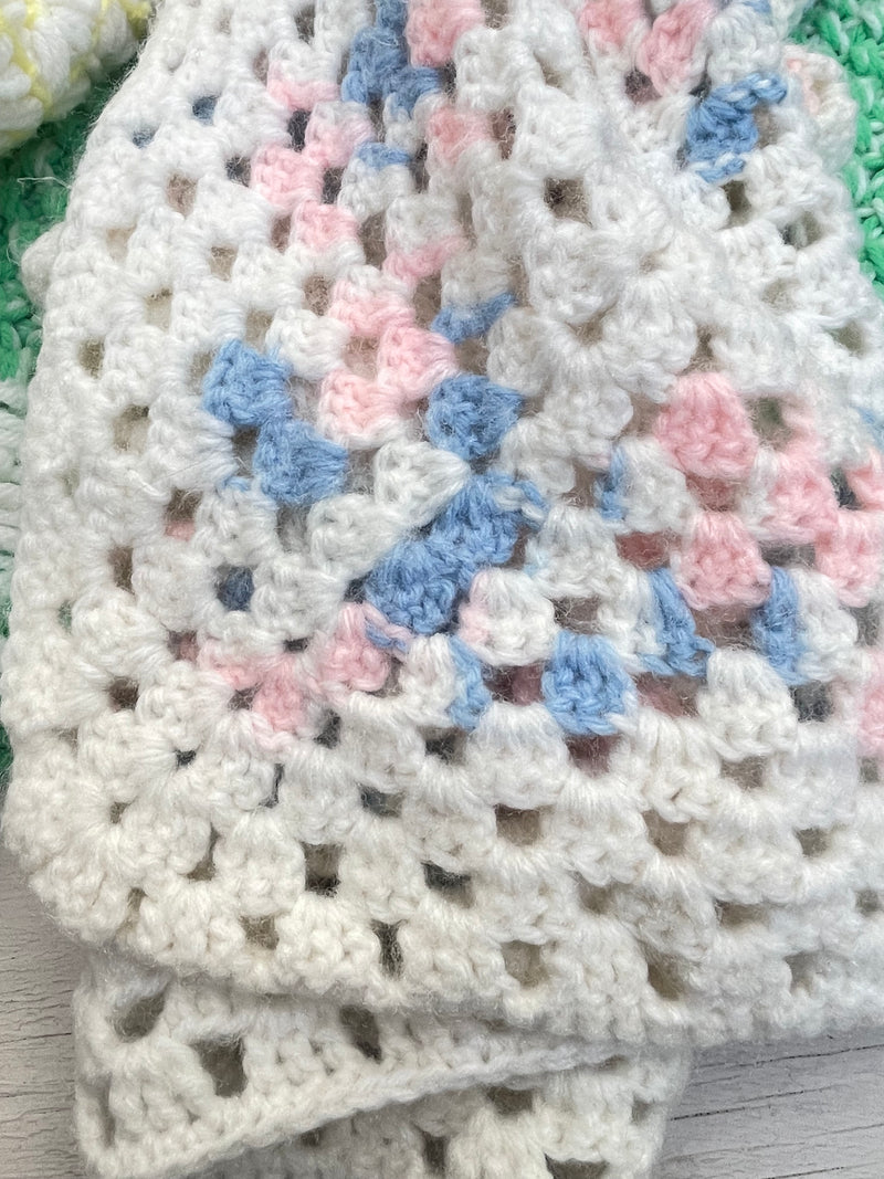 Pink blue and white crocheted baby blanket